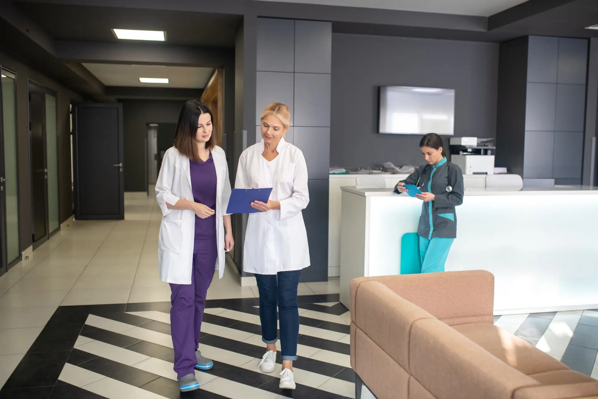Female doctors walking in clinic